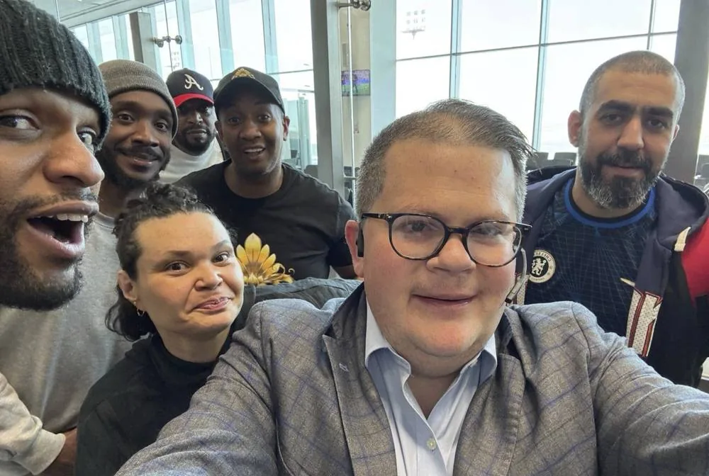 LUCID's founder with a group of freed Americans on their flight home from Kuwait
